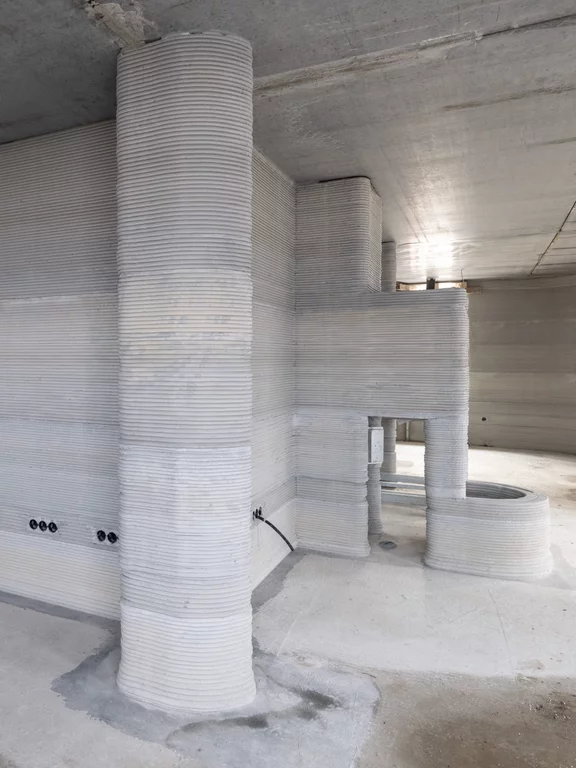 Дом 3D-принтера в Беккуме с закругленными углами. Особенность этого дома в том, что у него везде закругленные углы.