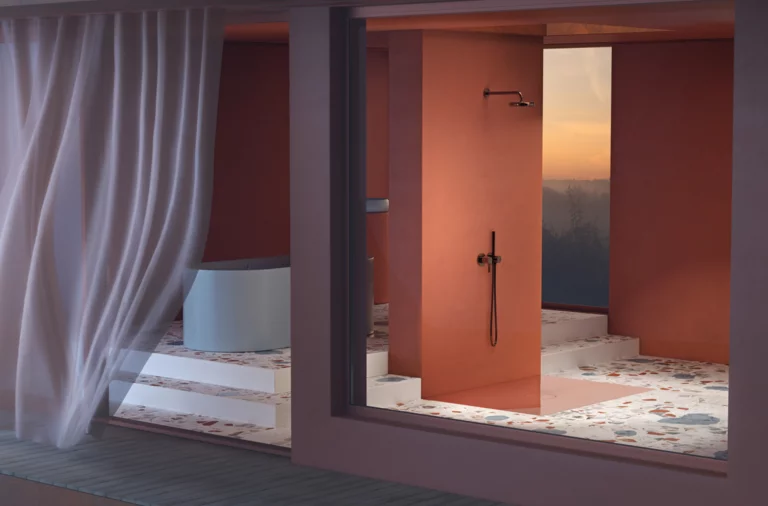 Salle de bain accessible avec baignoire ronde en acier émaillé, douche à l’italienne et grands carreaux, vue de l’extérieur.