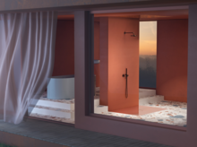 Accessible bathroom with round steel enamel bathtub, walk-in shower and large-format tiles, view from outside.