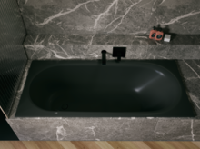 Black glazed titanium-steel bathtub in a grey stone-look surround, with black wall faucet and shelf.