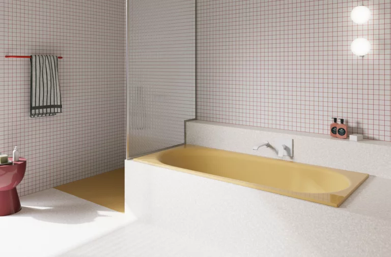 Yellow glazed titanium-steel bathtub in a bright bathroom with white tiles, wall faucet and open shower.