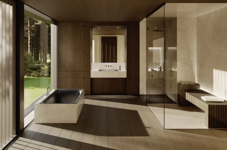 Salle de bains spacieuse avec baignoire encastrée sombre, paroi vitrée, douche de plain-pied, double vasque et vue sur la verdure.