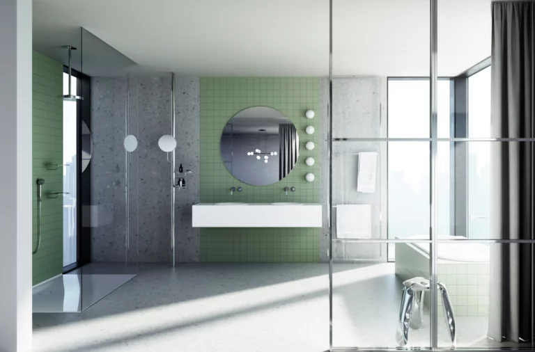 Modern bathroom with green tiles, large glass shower screen, double washbasin, round mirror, and built-in bathtub.