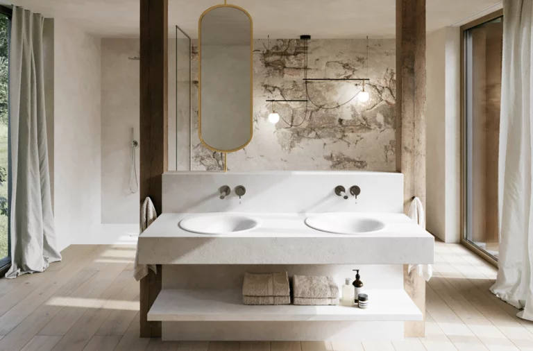 Bright bathroom with two white washbasins, wall-mounted taps, a large mirror and floor-to-ceiling windows with curtains.
