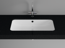Rectangular steel enamel washbasin in countertop, centrally mounted faucet below, classic design.