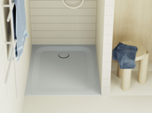 Square light blue shower tray with wall tiles, towel rack, and stool with clothes in a modern bathroom.