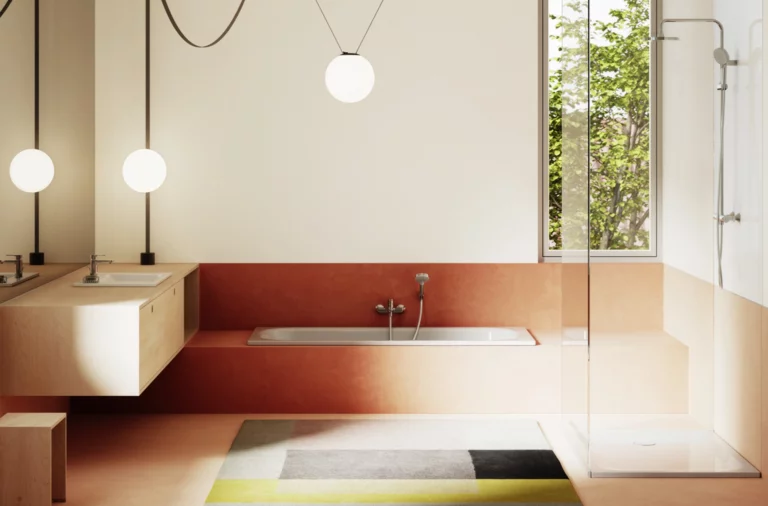 Modern bathroom with built-in bathtub, white shower tray, glass shower screen, vanity unit, and rug in front of tall window.