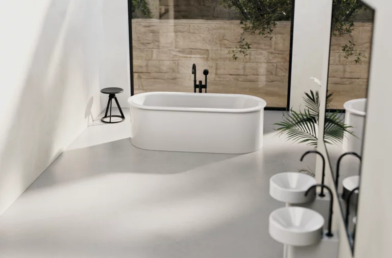 Freestanding oval bathtub made of steel enamel, two round washbasins on countertop, modern bright bathroom.